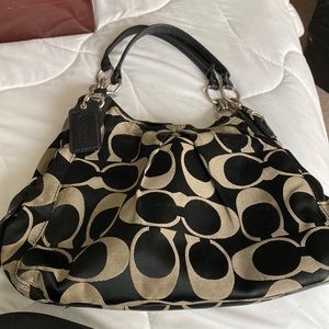 Three compartment coach purse.